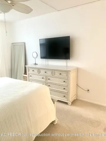 a spacious bedroom with a bed and a window