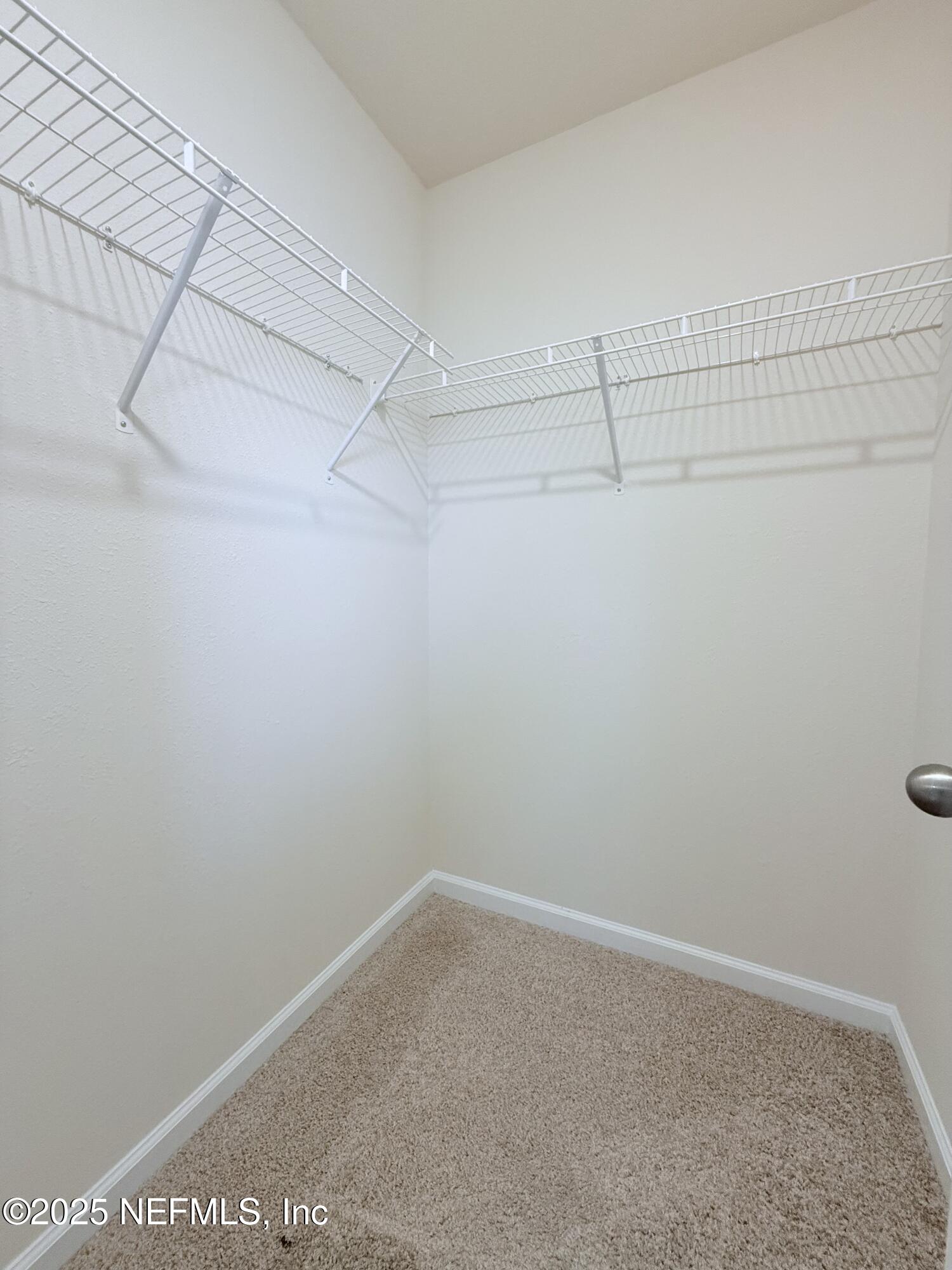 48 Java Lane St. Augustine, FL 32092 - Photo 11 of 26 a view of a room with racks on the wall