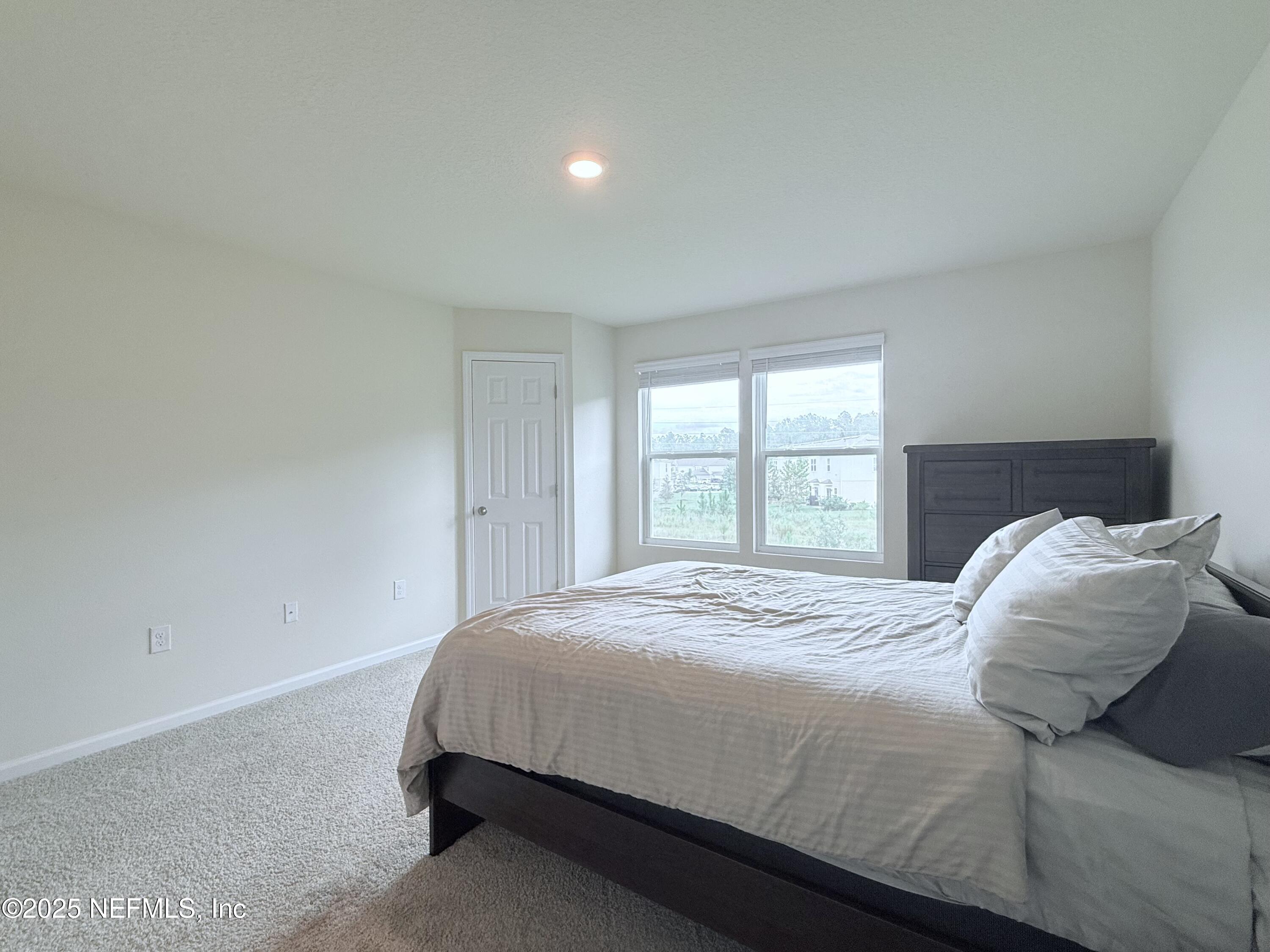 48 Java Lane St. Augustine, FL 32092 - Photo 15 of 26 a bedroom with a bed and a window