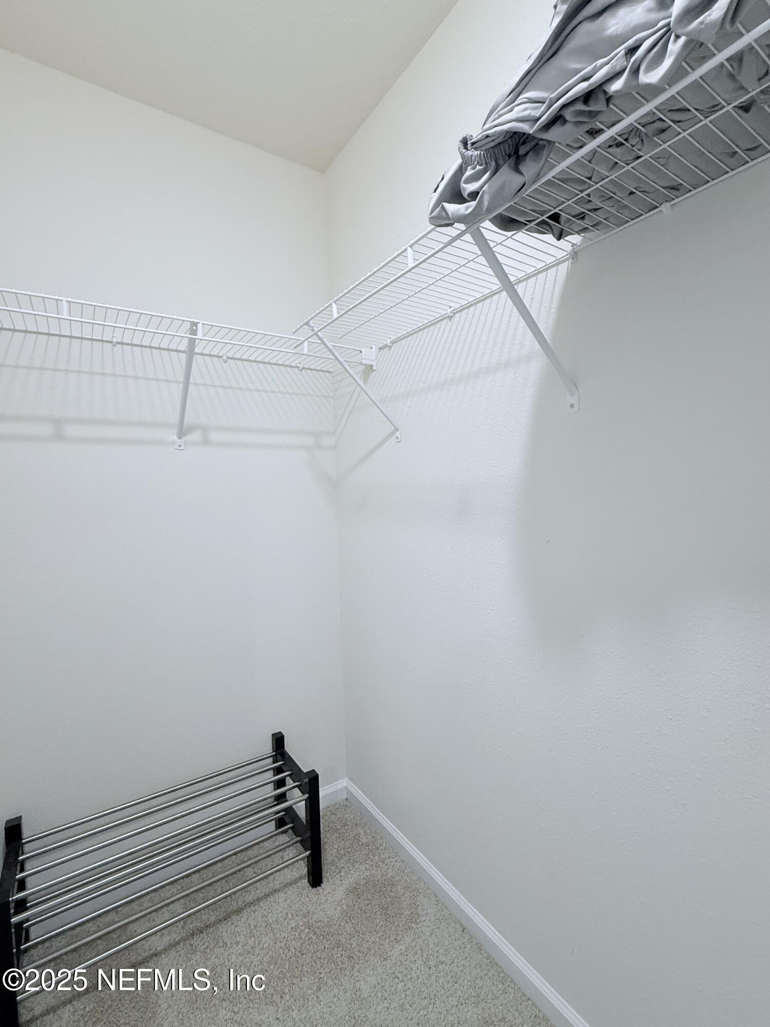 48 Java Lane St. Augustine, FL 32092 - Photo 16 of 26 a view of a room with racks on the wall