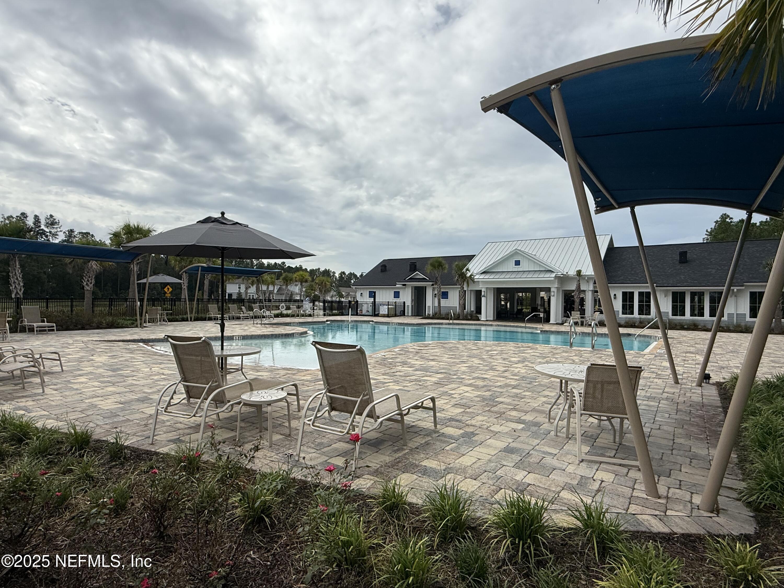 48 Java Lane St. Augustine, FL 32092 - Photo 26 of 26 a swimming pool with outdoor seating and yard