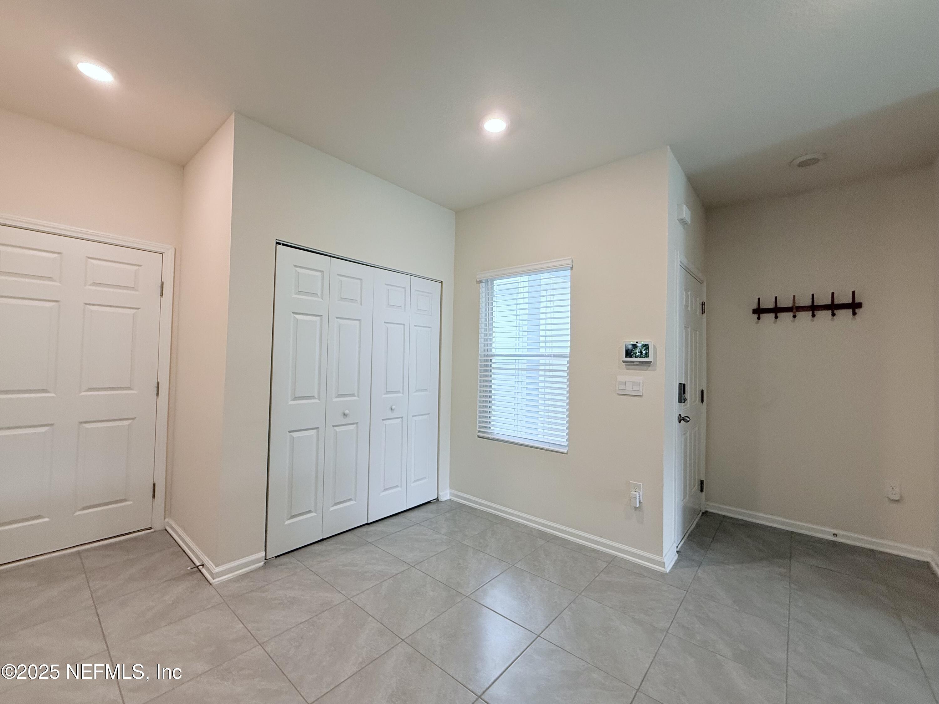 48 Java Lane St. Augustine, FL 32092 - Photo 4 of 26 an empty room with windows and closet