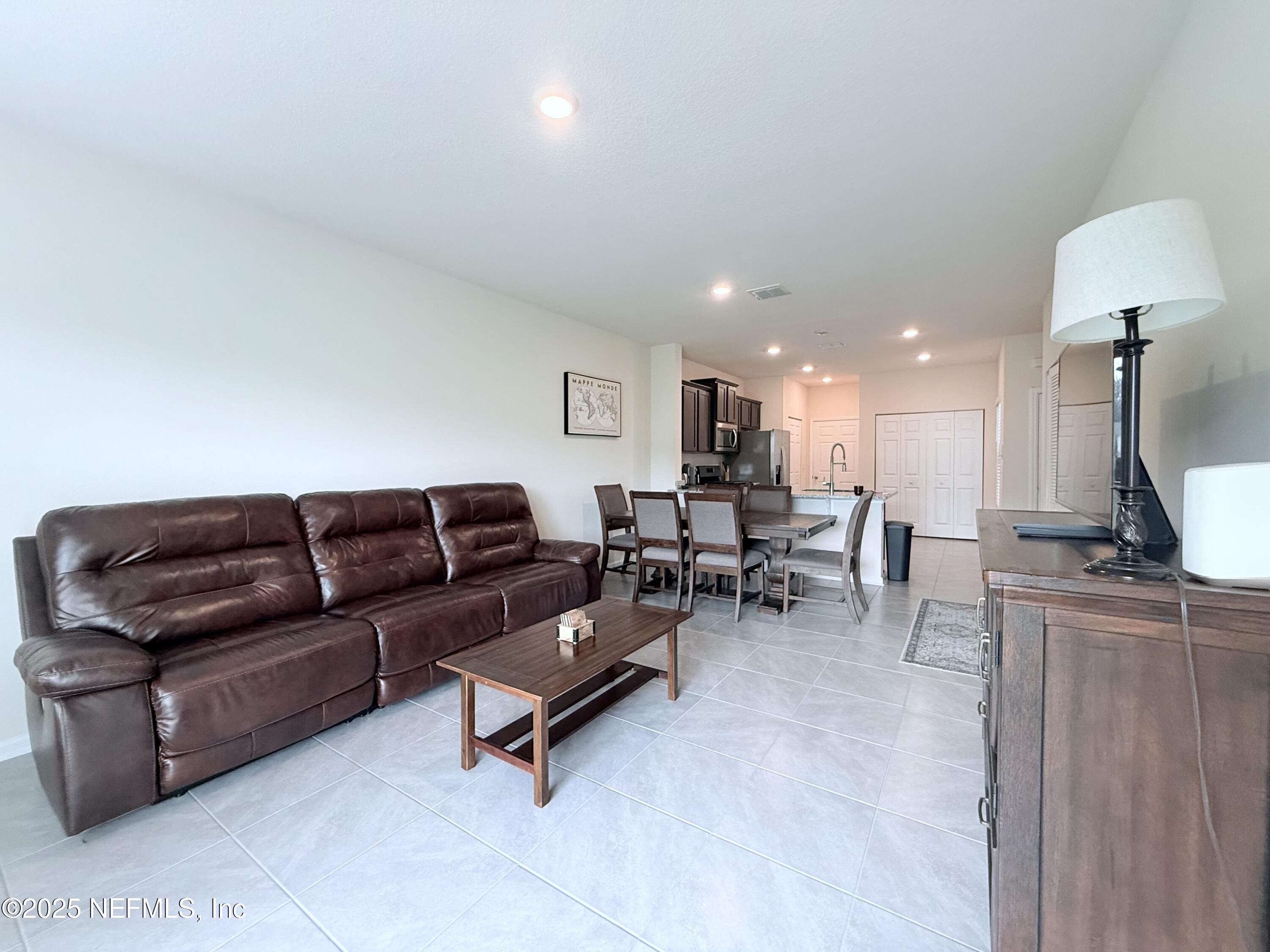48 Java Lane St. Augustine, FL 32092 - Photo 5 of 26 a living room with furniture and a table