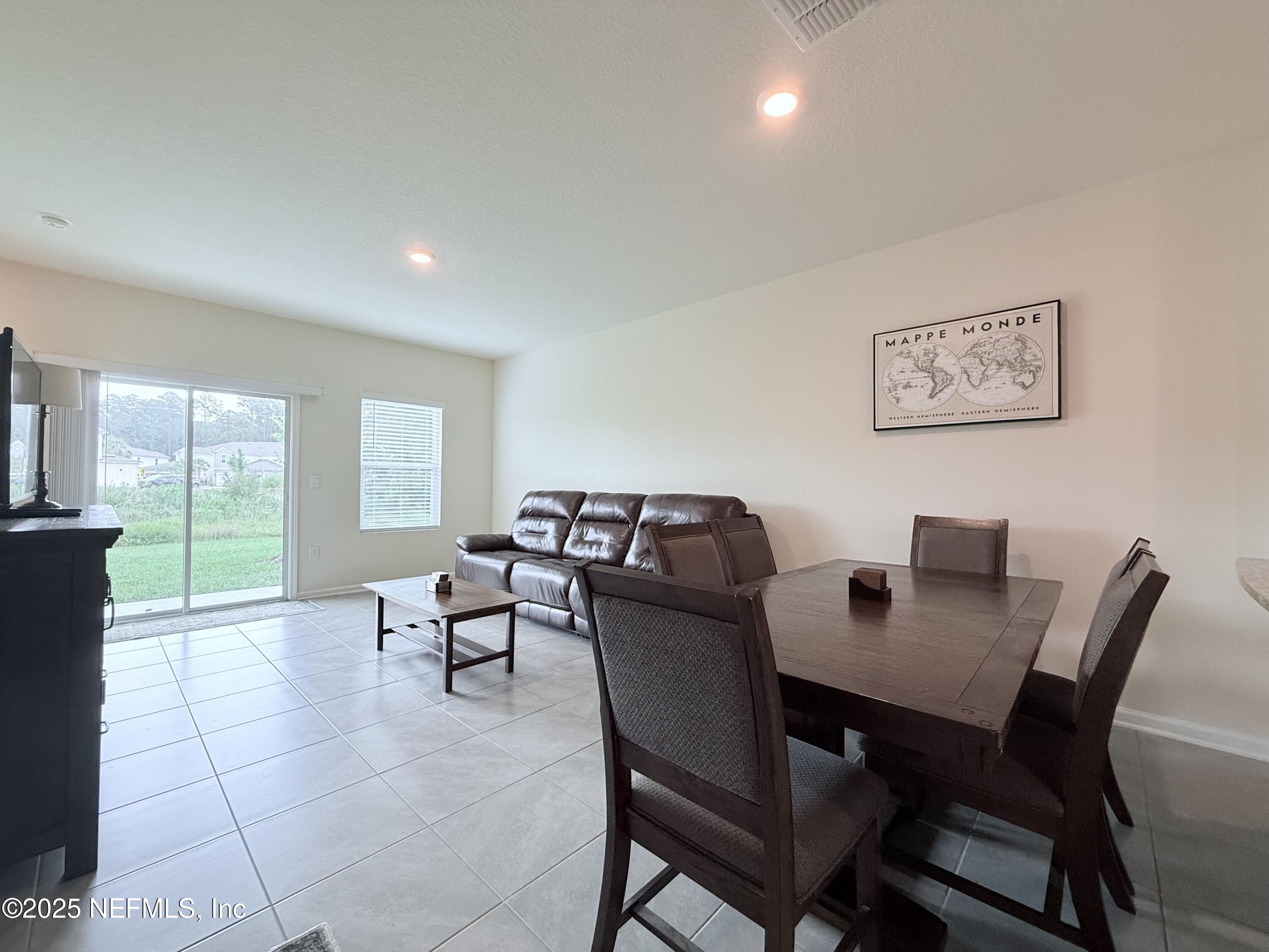 48 Java Lane St. Augustine, FL 32092 - Photo 7 of 26 a view of a dining room with furniture and a large window