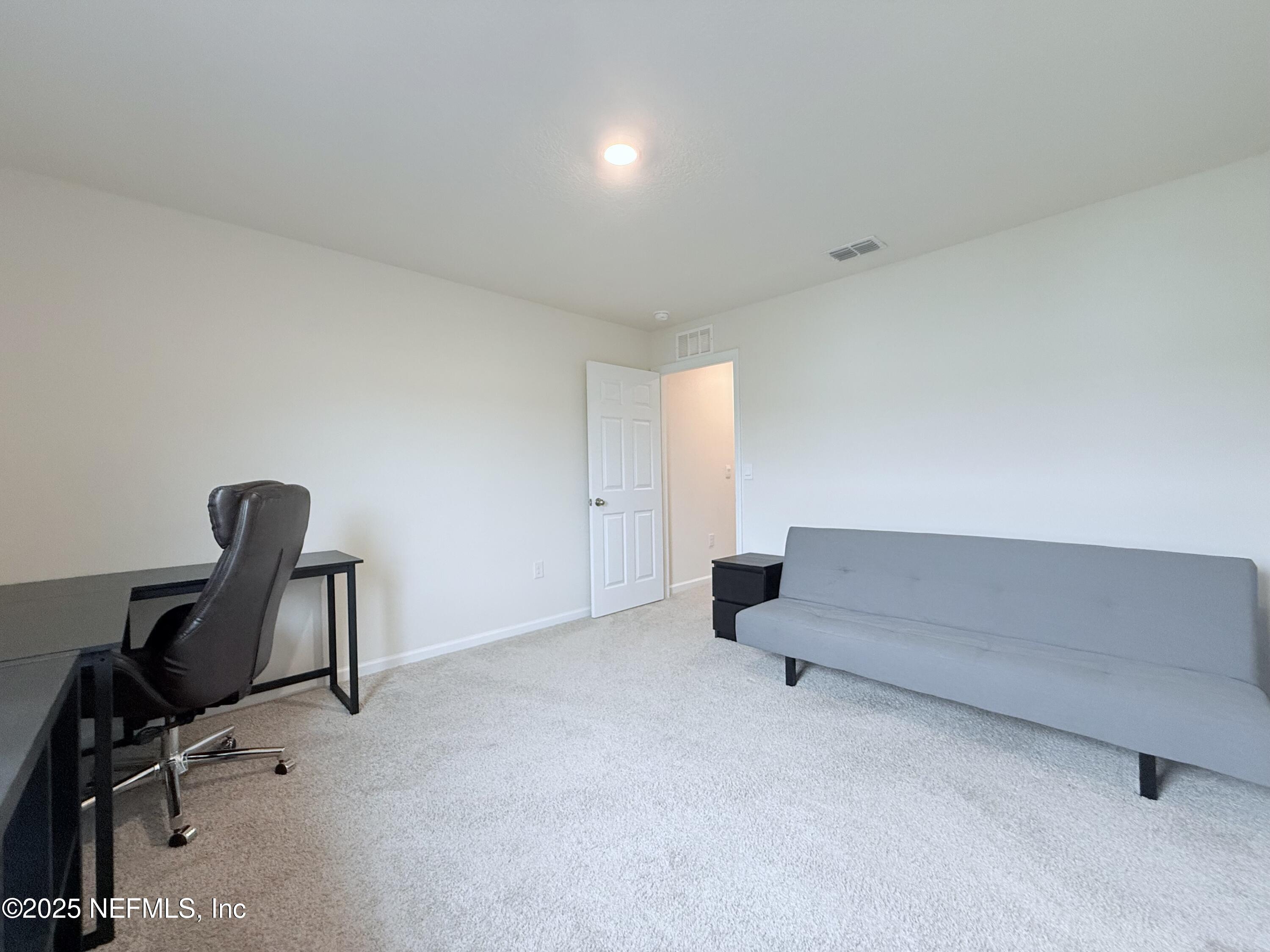 48 Java Lane St. Augustine, FL 32092 - Photo 10 of 26 a living room with furniture and a air conditioner vent