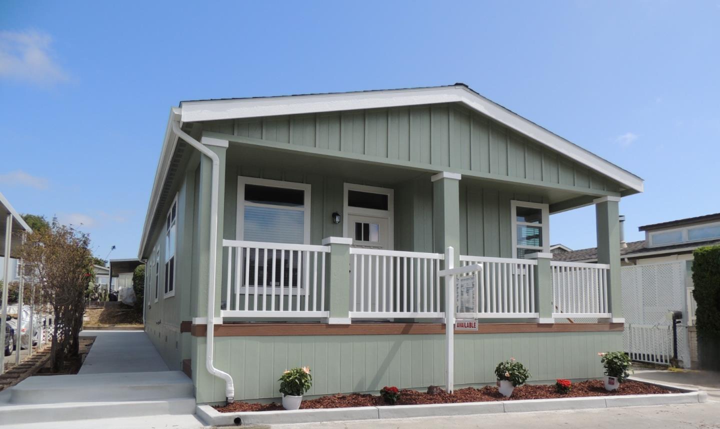 a front view of a house with garage