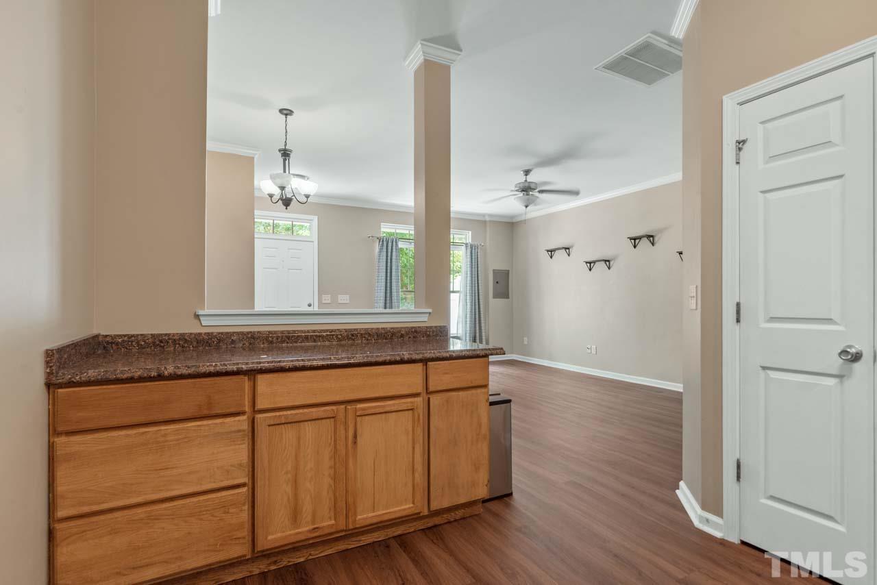 11720 Coppergate Drive, Unit 107 Raleigh, NC 27614 - Photo 11 of 26 a bathroom with a sink and a mirror