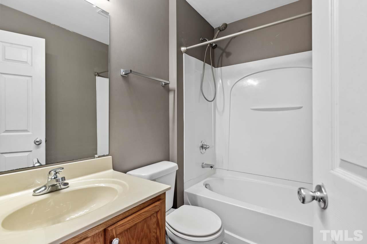 11720 Coppergate Drive, Unit 107 Raleigh, NC 27614 - Photo 13 of 26 a bathroom with a sink toilet and shower