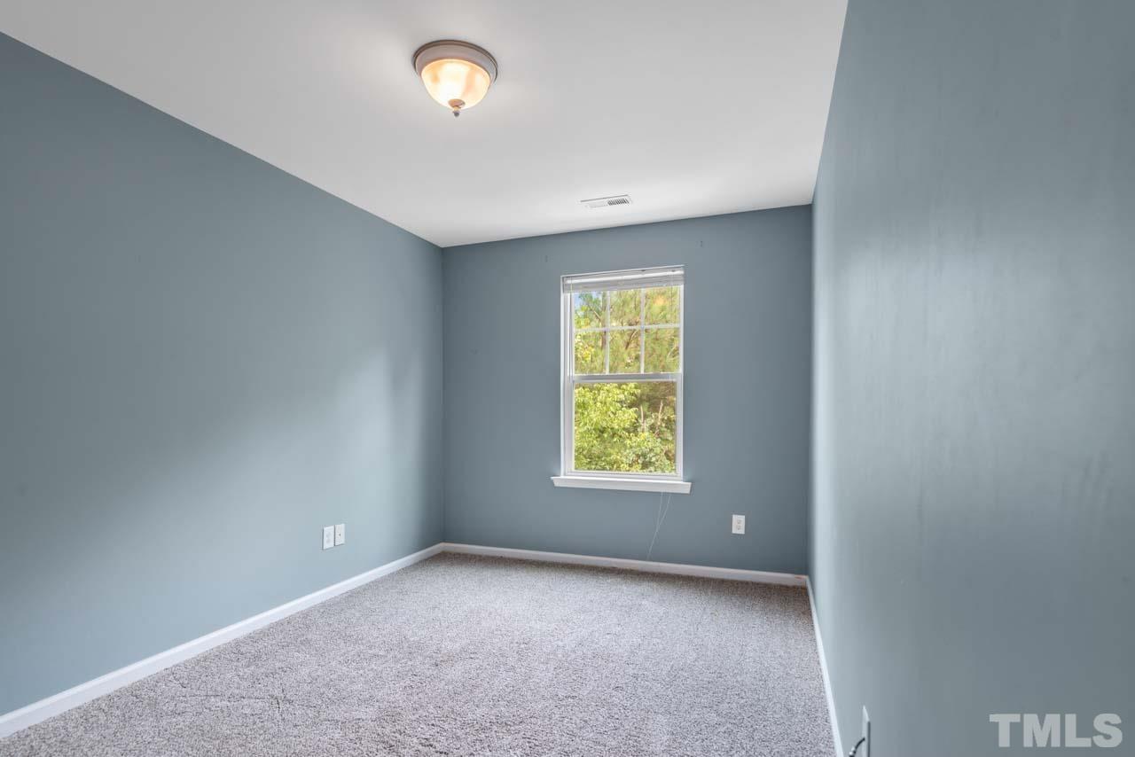 11720 Coppergate Drive, Unit 107 Raleigh, NC 27614 - Photo 14 of 26 an empty room with a window