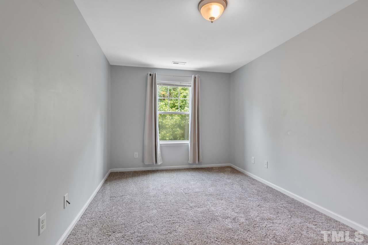11720 Coppergate Drive, Unit 107 Raleigh, NC 27614 - Photo 16 of 26 an empty room with windows