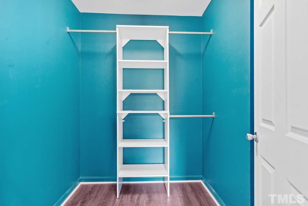 11720 Coppergate Drive, Unit 107 Raleigh, NC 27614 - Photo 19 of 26 a view of walk in closet with empty racks