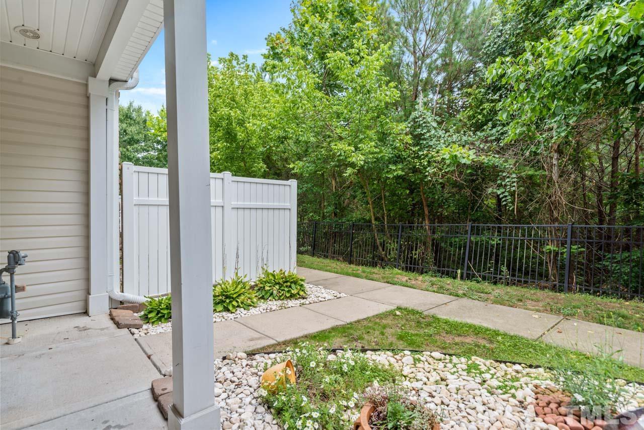 11720 Coppergate Drive, Unit 107 Raleigh, NC 27614 - Photo 3 of 26 a backyard of a house with lots of green space