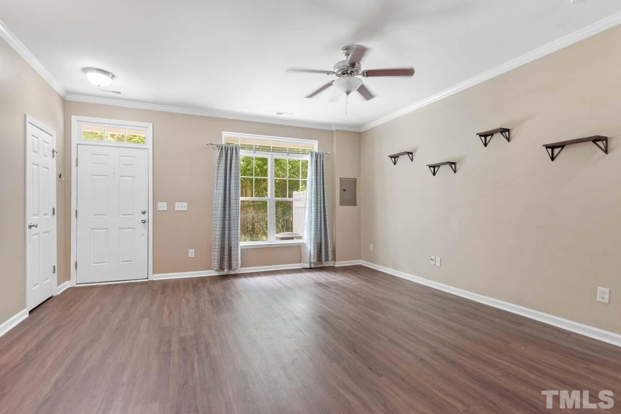 11720 Coppergate Drive, Unit 107 Raleigh, NC 27614 - Photo 6 of 26 wooden floor in an empty room with a window