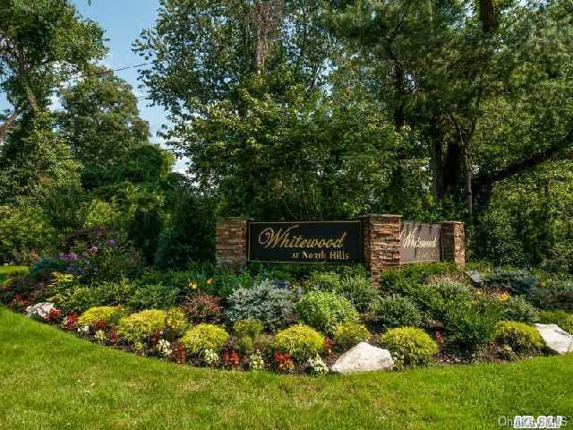 a view of sign board and garden