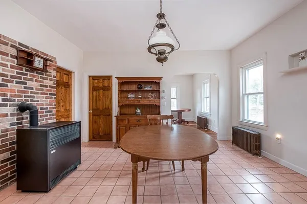 a dining room with furniture and window