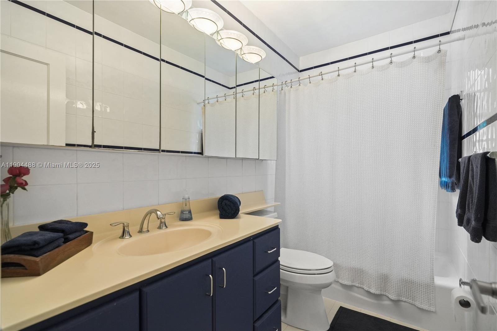 924 El Rado Street Coral Gables, FL 33134 - Photo 16 of 28 a bathroom with a sink vanity granite and toilet