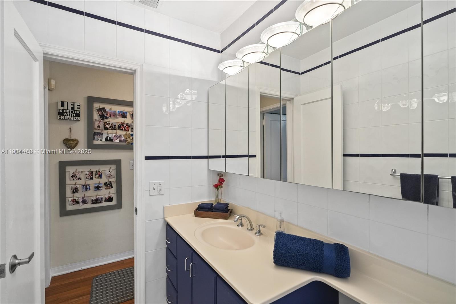 924 El Rado Street Coral Gables, FL 33134 - Photo 17 of 28 a bathroom with a sink and a mirror
