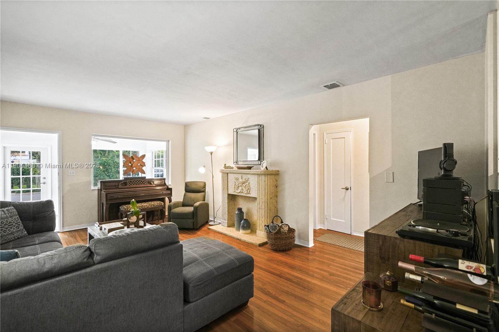 924 El Rado Street Coral Gables, FL 33134 - Photo 6 of 28 a living room with furniture and a flat screen tv