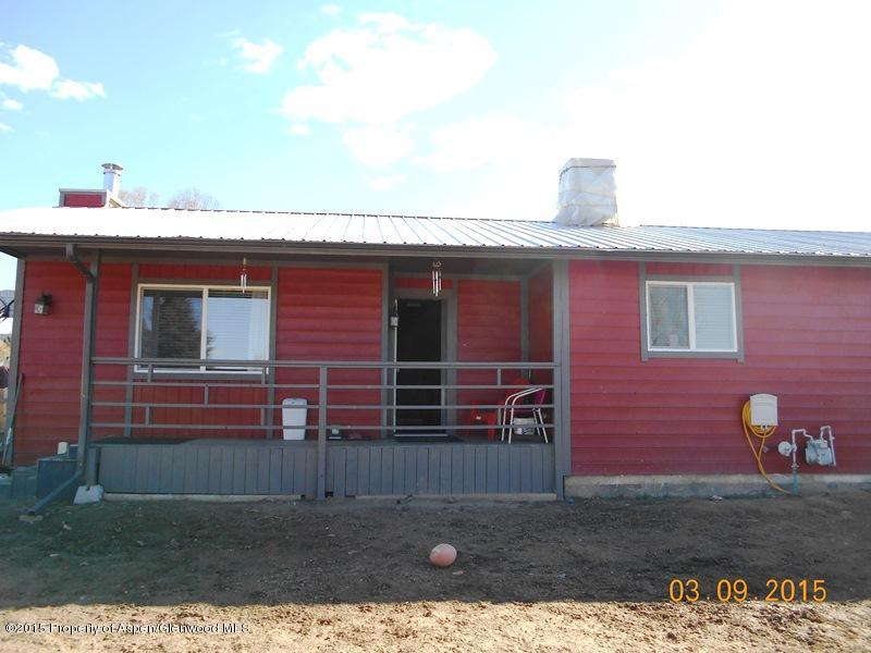 627 Fairway Avenue Rifle, CO 81650 - Photo 1 of 9 a front view of a house with a yard