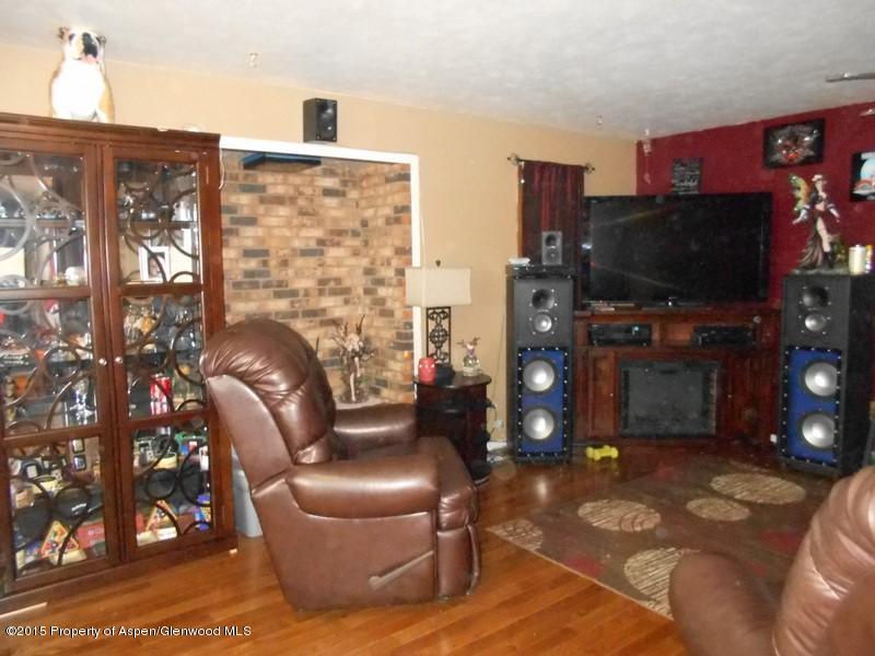 627 Fairway Avenue Rifle, CO 81650 - Photo 3 of 9 a living room with furniture and a flat screen tv