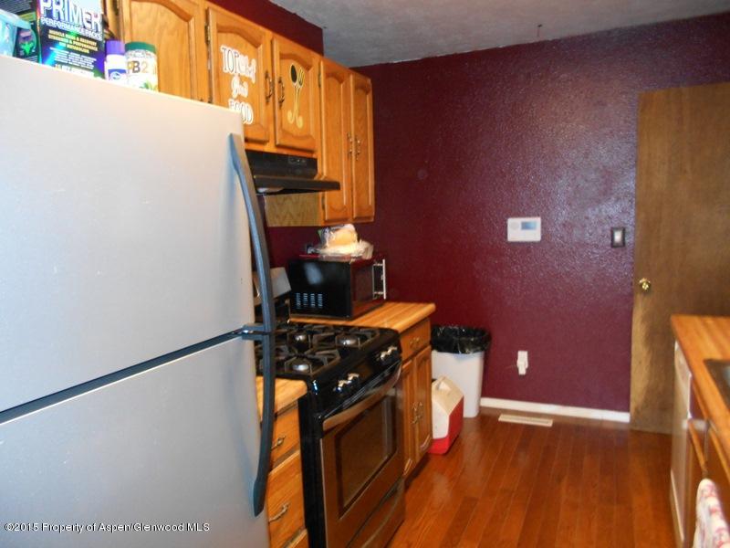 627 Fairway Avenue Rifle, CO 81650 - Photo 5 of 9 a kitchen with a stove top oven