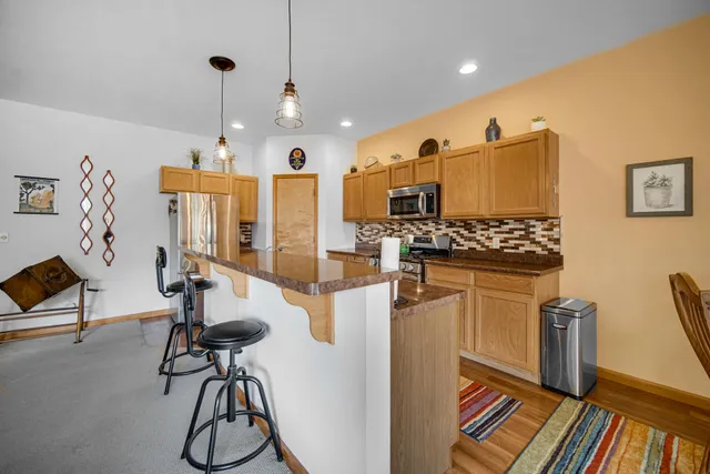 a very nice looking room with many windows and furniture