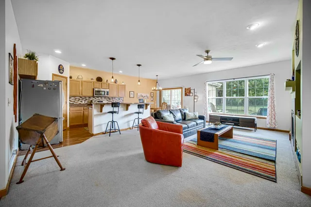 a living room with furniture and a potted plant