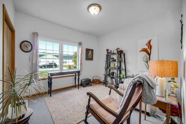 a view of hall way with furniture and chandelier