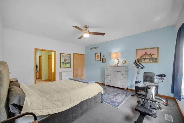 a bedroom with a bed and furniture