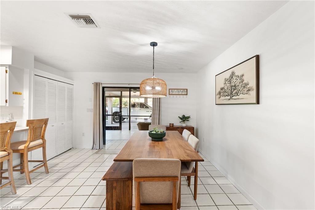 1030 13th Street Southwest Naples, FL 34117 - Photo 17 of 43 a view of a dining room with furniture window and outside view