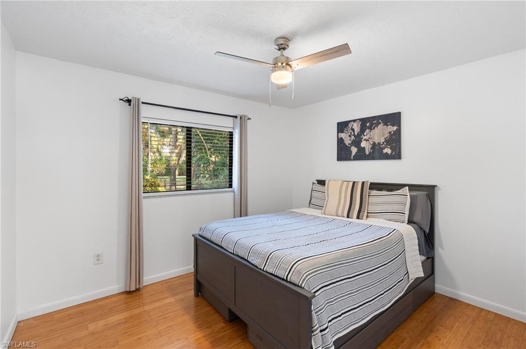1030 13th Street Southwest Naples, FL 34117 - Photo 22 of 43 a bedroom with a bed and a window