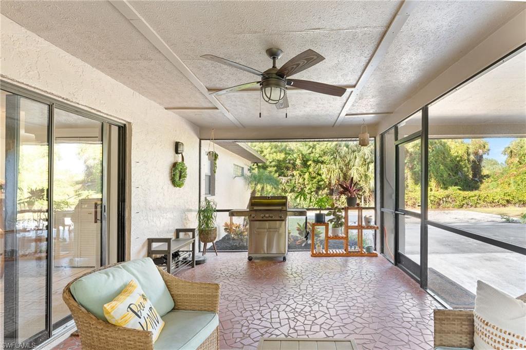 1030 13th Street Southwest Naples, FL 34117 - Photo 23 of 43 a living room with furniture and a large window