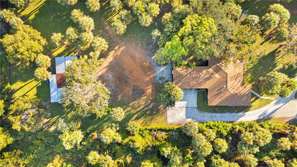 1030 13th Street Southwest Naples, FL 34117 - Photo 39 of 43 a house view with a garden