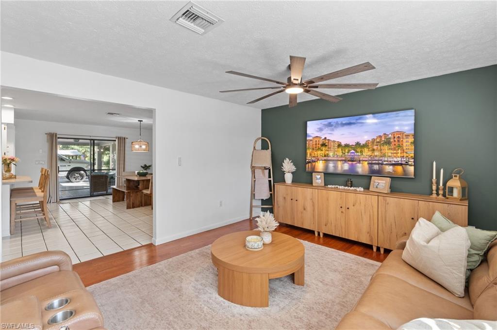 1030 13th Street Southwest Naples, FL 34117 - Photo 7 of 43 a living room with furniture and a flat screen tv