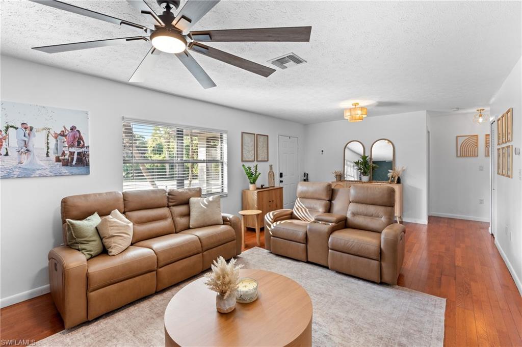 1030 13th Street Southwest Naples, FL 34117 - Photo 8 of 43 a living room with furniture and a large window