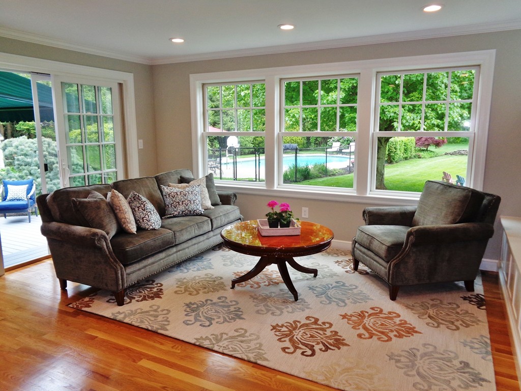 91 Winding River Road Needham, MA 02492 - Photo 13 of 27 a living room with furniture and a rug