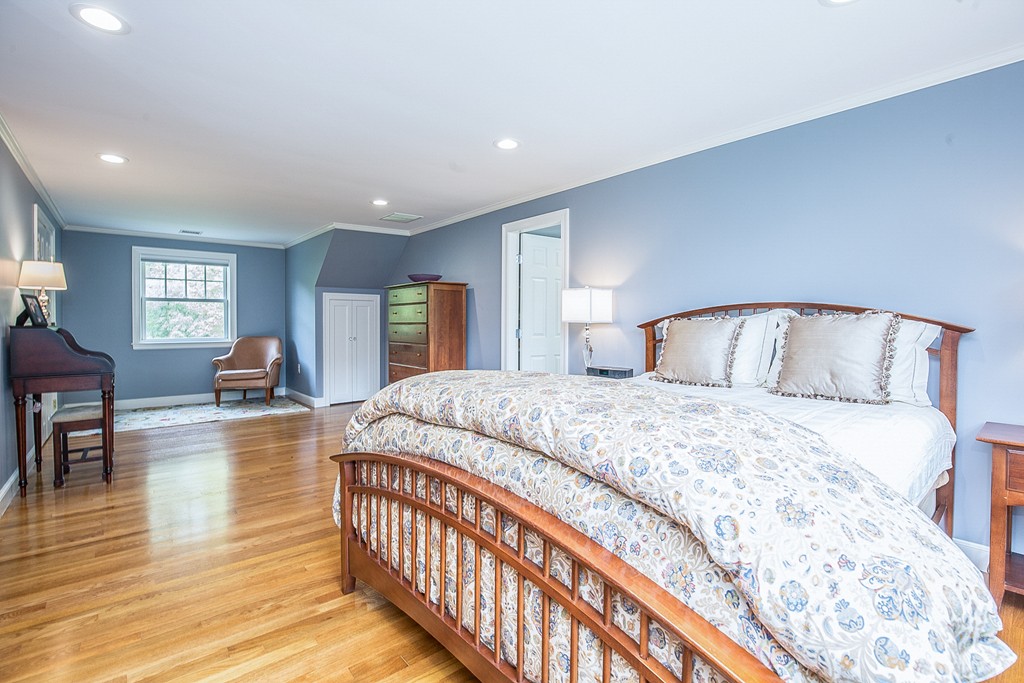 91 Winding River Road Needham, MA 02492 - Photo 16 of 27 a bedroom with bed and wooden floor