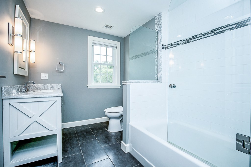 91 Winding River Road Needham, MA 02492 - Photo 20 of 27 a bathroom with a sink toilet and shower
