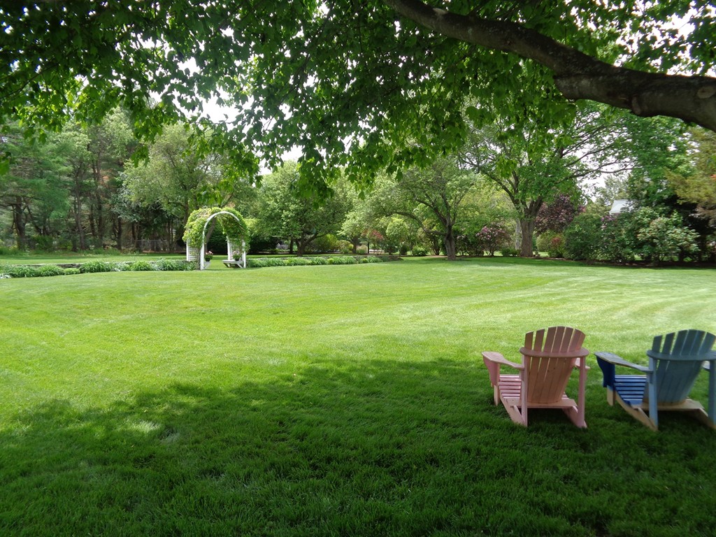 91 Winding River Road Needham, MA 02492 - Photo 25 of 27 a view of a golf course with a garden