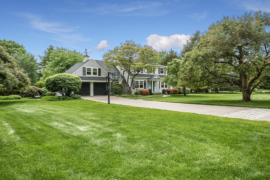 91 Winding River Road Needham, MA 02492 - Photo 3 of 27 a front view of a house with a yard
