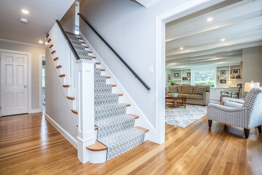 91 Winding River Road Needham, MA 02492 - Photo 6 of 27 a view of entryway and hall with wooden floor