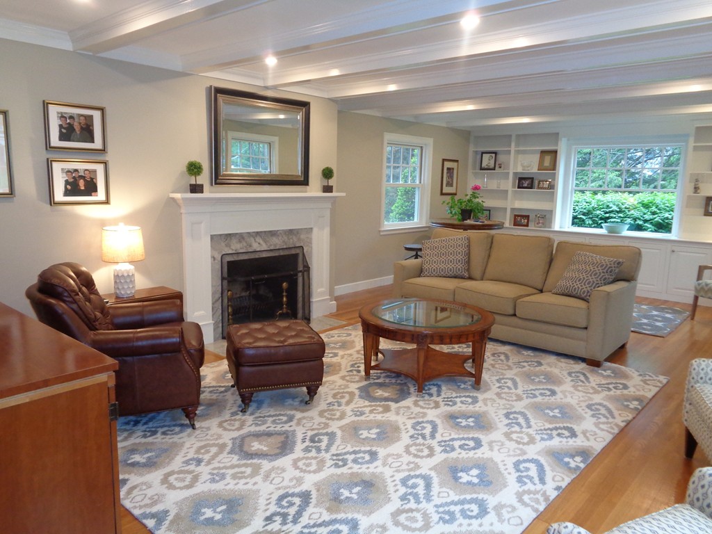 91 Winding River Road Needham, MA 02492 - Photo 7 of 27 a living room with furniture and a fireplace