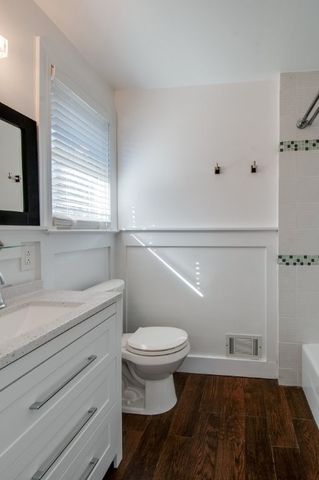 a bathroom with a bathtub and shower