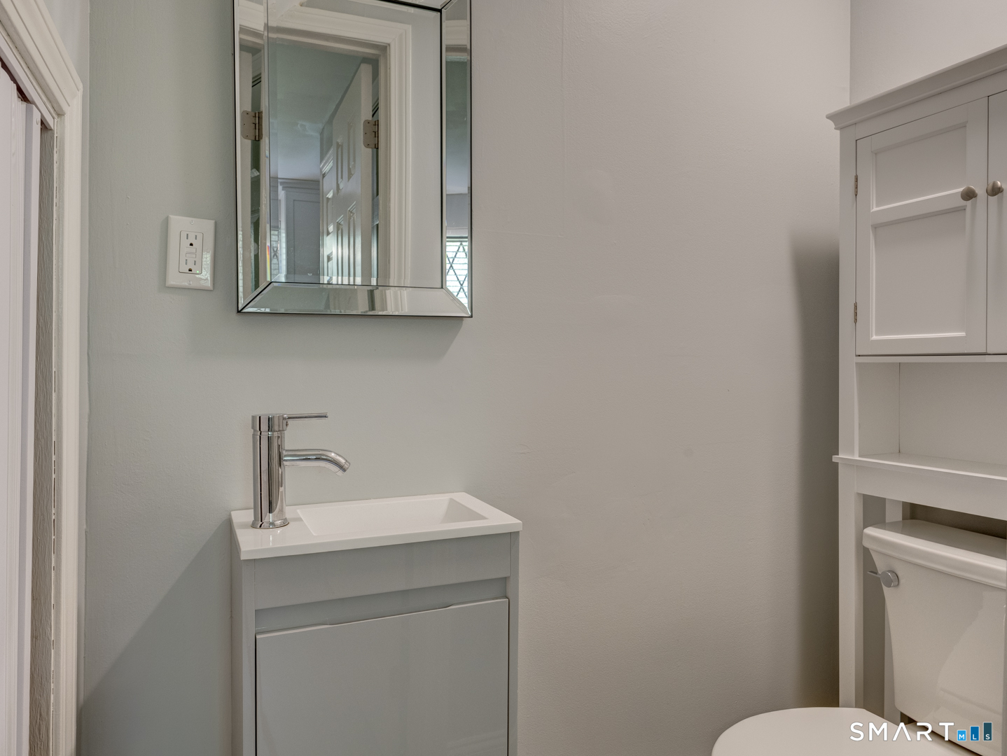 2 Branch Road, Unit 2C Thomaston, CT 06787 - Photo 12 of 26 a bathroom with a toilet sink and mirror