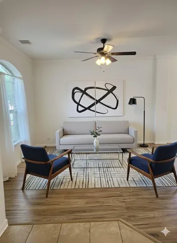 an empty room with a empty space and a ceiling fan