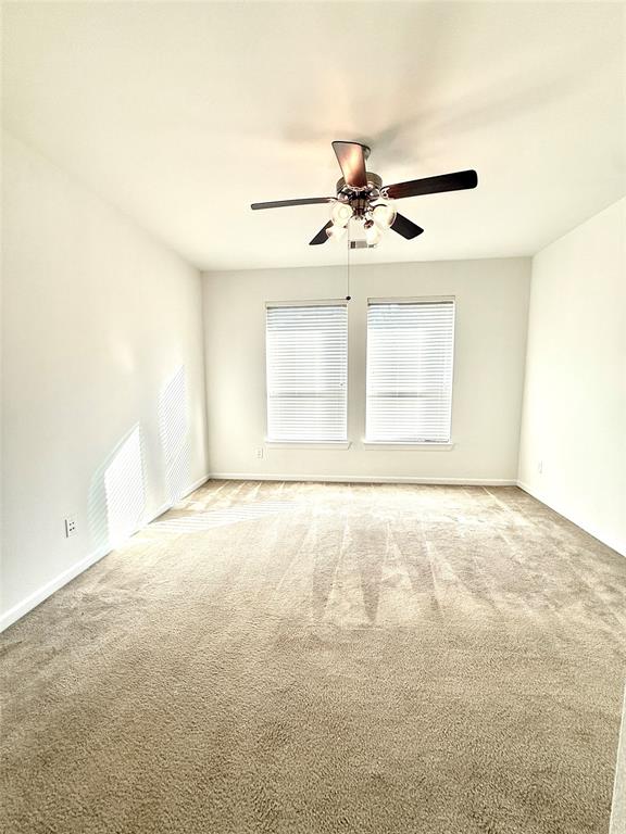 5737 Yorkshire Road McKinney, TX 75070 - Photo 16 of 19 an empty room with a empty space and a ceiling fan