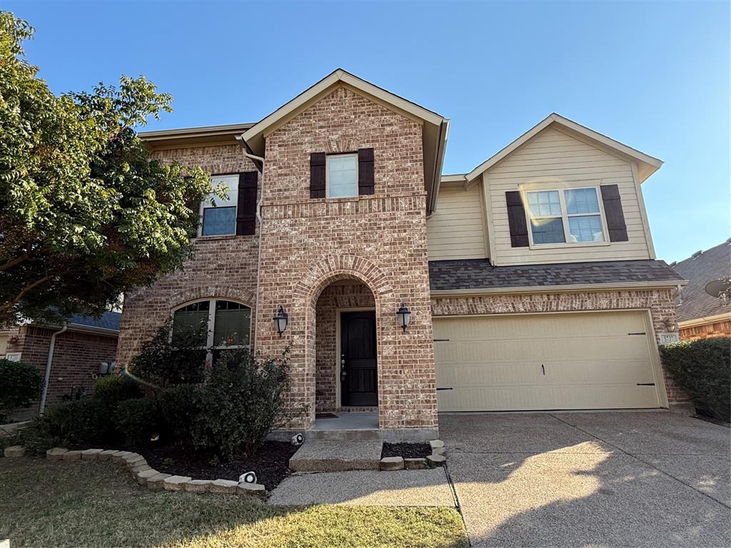 5737 Yorkshire Road McKinney, TX 75070 - Photo 2 of 19 a front view of a house with garden