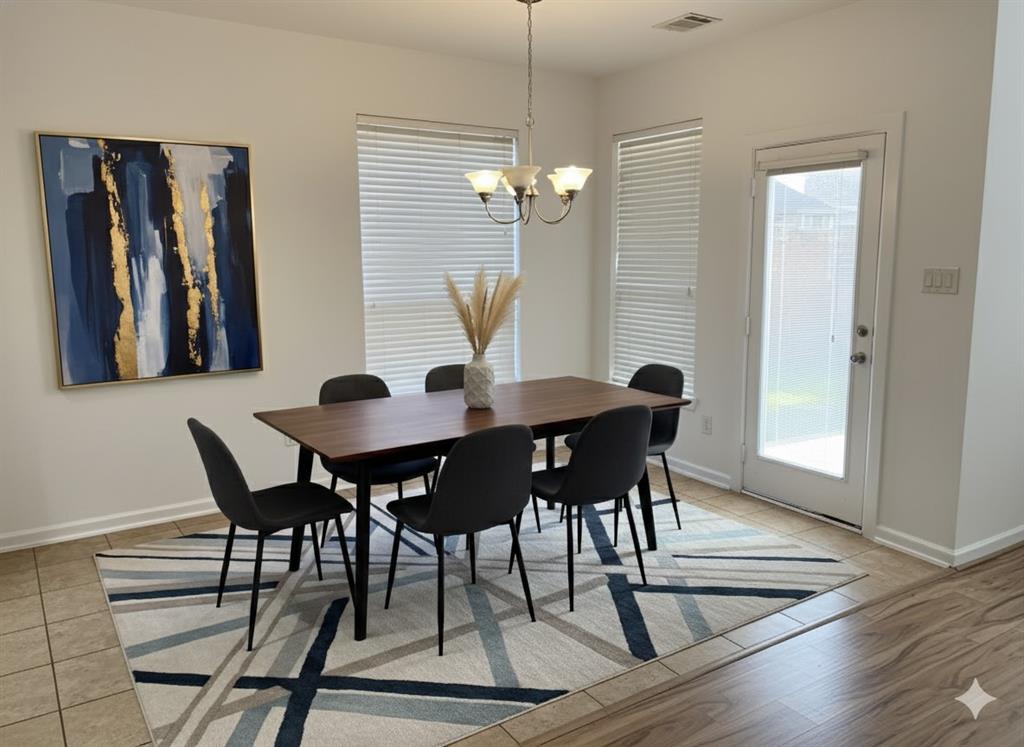 5737 Yorkshire Road McKinney, TX 75070 - Photo 5 of 19 a view of a dining room with furniture and wooden floor