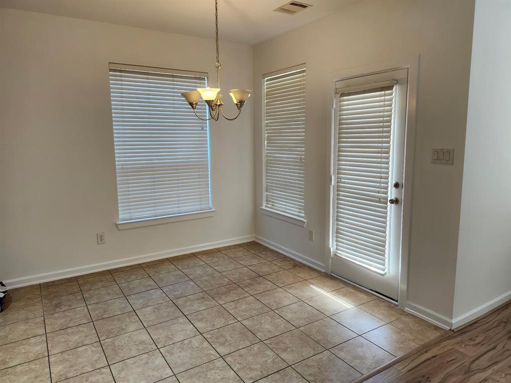 5737 Yorkshire Road McKinney, TX 75070 - Photo 6 of 19 an empty room with windows and ceiling fan