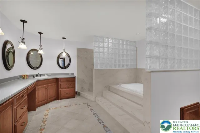 a view of a room with gym equipment and a large window